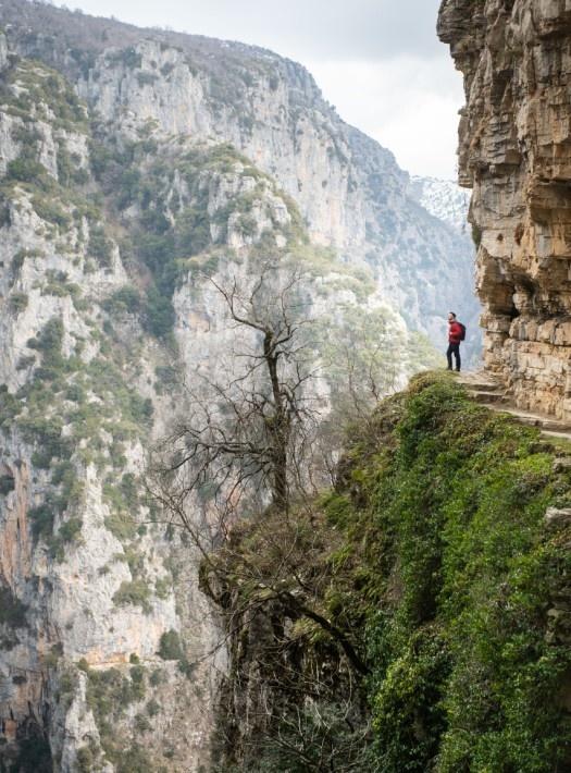 man on the top of a mountain with view